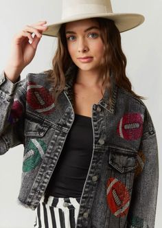 This Rhinestone Football Denim Jacket is a perfect way to express your love for the game! It features a washed black denim jacket with colorful rhinestone footballs, and a raw edge bottom hem. Plus, it buttons up the front for easy on and off. Show off your spirit in style! SIZE DOWN from your typical size -Collared -Long sleeves -Button-down closure -Pockets -Cropped -Raw hem 100%cotton Casual Denim Jacket With Rhinestones, Casual Fall Denim Jacket With Rhinestones, Casual Rhinestone Denim Jacket For Fall, Rhinestone Patches, Confident Fashion, Patch Denim Jacket, Rhinestone Football, Football Jacket, Patch Denim