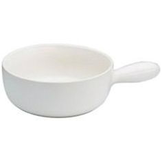 a white bowl with a spoon on the side and an oval handle in the middle