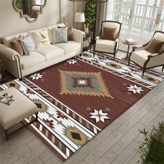 a living room filled with furniture and a large rug on top of a wooden floor