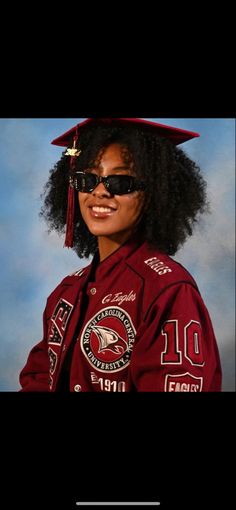 a young woman wearing sunglasses and a red graduation cap with the number 10 on it