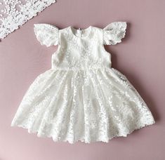 Baptism Dress With Short Sleeves.  This dress is made of natural cotton and elegant floral lace. The colour is ivory.  The inside of the dress is lined of natural cotton so your baby girl will feel comfortable. It has a cozy zipper in the back. Choose from size newborn  to 3T.  Please, check attentively all your measurements at the size chart  on the second photo. If you have specific requests, our team is happy to create a custom dress for you. You can order all the matching outfit: bonnet, headband, booties, bloomers, blanket. Link for : *bonnet: https://www.etsy.com/listing/785768002/baptism-bonnet-lace-bonnet-baptism-baby?click_key=0901abbc1c12db427f8509d71a98750c1773883c%3A785768002&click_sum=cecc4772&ref=shop_home_active_4&frs=1&sts=1 *headband: https://www.etsy.com/listing/140976942 Outfit Bonnet, Girl Baptism Dress, Christening Blanket, Girls Baptism Dress, Dress For Baby Girl, Lace Bonnet, Beautiful Museum, Girl Baptism