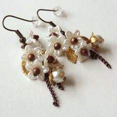 Lily - secret garden series - earrings with pearls and antique vintage flower parts Vintage Dangle Flower Earrings For Wedding, Handmade Vintage White Clip-on Earrings, Vintage Pearl Clip-on Earrings As Gift, Vintage Pearl Clip-on Earrings For Gift, Handmade Flower Pearl Earrings, Handmade Flower-shaped Pearl Earrings, Vintage White Pearl Drop Earrings, Vintage White Flower Drop Earrings, Handmade Pearl Dangle Flower Earrings