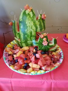 a watermelon and fruit platter on a table