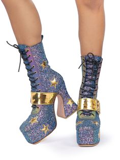 Made to order. Please allow 3-4 weeks for us to make your magic. Add your shoe size and/or measurements to the notes in your shopping cart for a perfect fit! Get ready to rock out on Mars with our handmade glitter platform boots. Inspired by the 70s glam rock era, these boots feature a hand carved wooden heel, glitter PVC outer layer, gold stars, and a gold belt on the front. Turn the flashlight on and the front detailing on the boots lights up rainbow for some extra cosmic magic. The square toe Glam Rock Shoes, 70s Platform Boots, 70s Glam Rock, Cosmic Magic, 70s Glam, Headpiece Accessories, Rave Girl, Gold Belt, Life On Mars