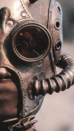 a close up of a person wearing a gas mask