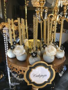 a table topped with lots of white and gold decorations