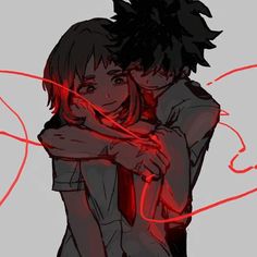 two people hugging each other with red neon lights around them