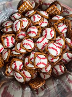 a bowl filled with pretzels covered in white and red icing