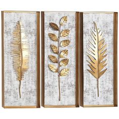 three gold leaf wall art pieces on a white background