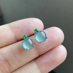 This listing is for a pair of rare light blue jadeite cabochon earrings. It is made of natural, type A jadeite.  --DETAILS-- Grade: Natural, untreated, type A Jade type: Jadeite Color: Bluish green Degree of translucency: MED-HIGH Jadeite stone condition: No cracks or other imperfections Jade cabochon size: 9.2mm Item SKU: REU-0012 --SHIPPING INFORMATION-- Once your item has prepared for shipment and ships, you will receive a Shipment Notification email with carrier and tracking information.  -- Blue Jade Jewelry, Luxury Blue Jade Jewelry, Light Blue Gemstone Earrings - Fine Jewelry, Light Blue Gemstone Round Earrings, Jadeite Jewelry, B + C, Cabochon Earrings, Blue Jade, Jade Earrings