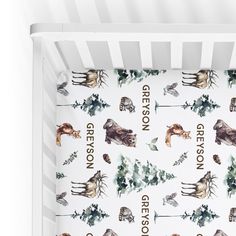 a crib sheet with deer and moose designs on the bottom, along with words that read gresson