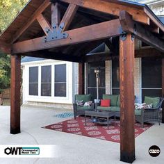 an outdoor covered patio area with furniture