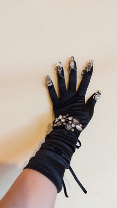 This model is unique and will not be repeated! Made of satin with crystals. The glove size is suitable for light to medium hands! ship immediately with express delivery. Please enter your phone number when ordering, the postal company requires it. All products are made in Europe with high quality workmanship. I use professional materials for manicure and nails. Make a statement with these mesmerizing burlesque nail gloves! Designed for the bold and daring, these gloves are adorned with metallic Elegant Jewelry For Cosplay, Elegant Adjustable Jewelry For Costume Party, Elegant Black Jewelry For Cosplay, Elegant Adjustable Jewelry For Cosplay, Luxury Rhinestone Party Bracelets, Luxury Rhinestone Bracelets For Party, Gothic Metal Bracelets For Party, Elegant Black Jewelry For Costume Party, Black Crystal Bracelets For Party