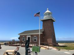 an old brick building with a flag on top