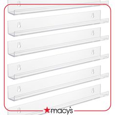 four clear shelfs with red trim on each side and the words macy's above them