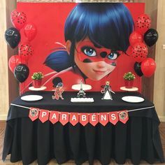 a black table topped with red and black balloons next to a sign that says parabens