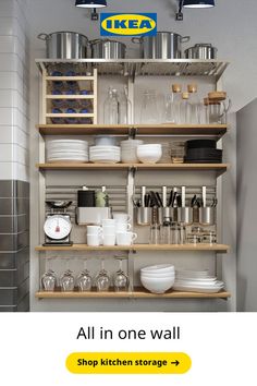 a kitchen shelf filled with lots of pots and pans next to a sign that says ikea all in one wall shop kitchen storage