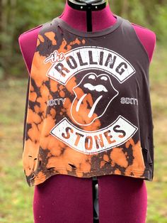 This Rolling Stones graphic tea has been distressed and bleached eyed. Sleeves have been removed making it a tank top. Great rocker shirt! Size medium, but will fit large. Grunge Tank T-shirt For Summer, Summer Grunge Tank T-shirt, Summer Grunge Muscle Tee With Crew Neck, Summer Grunge Crew Neck Muscle Tee, Distressed Cotton Tops For Music Festival, Casual Acid Wash Top For Music Festival, Summer Grunge Graphic Print Muscle Tee, Distressed Band Merch Top In Faded Color, Acid Wash Band Merch Tops For Music Festival