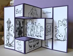 an open card with pictures of halloween characters on the front and back, in black and white