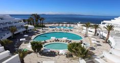 an aerial view of the pool and beach area