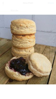 three biscuits stacked on top of each other with blueberry filling