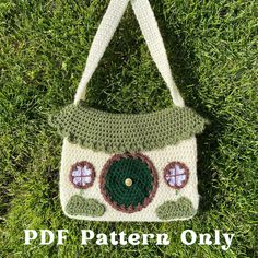 a crocheted purse sitting on top of grass with the words, free pattern only