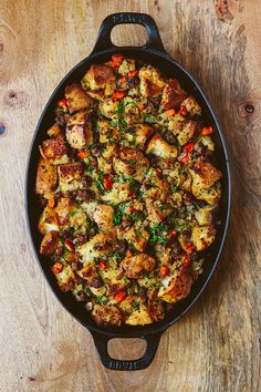 a pan filled with food on top of a wooden table