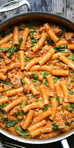 Creamy Sausage Rigatoni with Spinach, Garlic, and Tomato Cream Sauce in a stainless steel pan. Creamy Sausage Rigatoni, Chicken Breaded, Rigatoni Pasta Recipes, Sausage Rigatoni, Rigatoni Recipes, Tomato Cream Sauce, Sausage Pasta Recipes, Chicken Cutlet, Italian Sausage Pasta