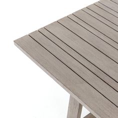 a close up of a wooden table on a white background with no people around it