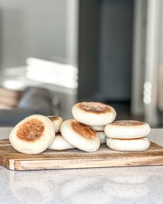 some food is sitting on top of a cutting board