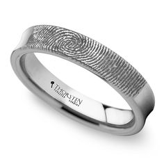 a white gold wedding band with a fingerprint pattern on the side and an inscription that reads