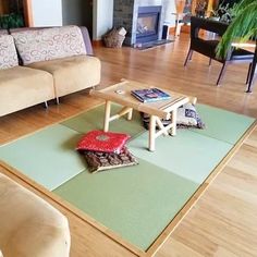 a living room with two couches and a coffee table in the middle of it