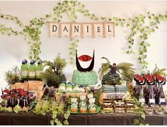 a table topped with lots of food and desserts