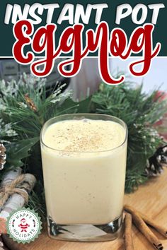 an eggnog drink in a glass with cinnamon sticks on the side