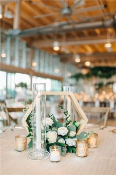 a table with candles and flowers on it