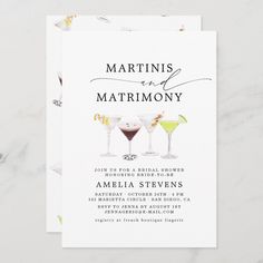 the martinis and matrimony wedding card is shown on a marble table top