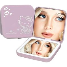 an open pink hello kitty makeup box with blue eyes and white eyelashes on the lid