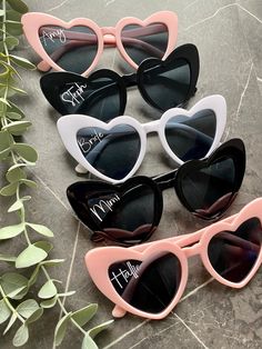 four heart shaped sunglasses with the words happy mother written on them