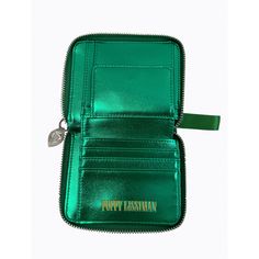 The 2022 version of one of our best selling styles, the PL Fold wallet with grass green mock croc embossed faux leather outer, metallic green faux leather lining, matching branded wrist strap and custom Evil Eye YKK zipper tab. Wallet features coin compartment, 5 slots for cards and area for cash. 9.5cm x 12.5cm Green Wallet With Card Slots, Green Leather Coin Purse With Card Slots, Green Zipper Clutch Wallet, Rectangular Green Coin Purse With Zipper, Green Rectangular Coin Purse With Zipper Closure, Green Leather Wallets With Zipper Closure, Green Leather Wallet With Zipper Closure, Fold Wallet, Green Grass