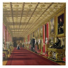 an ornate hallway with paintings on the walls and red carpeted flooring in front of it