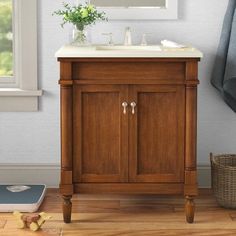 a bathroom with a wooden vanity and mirror