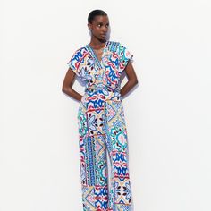 Zara Satin Effect Print Jumpsuit Size M New With Tag! V-Neck Jumpsuit With Short Sleeves. Front Knot At Waist. Wide Leg. Back Hidden In-Seam Zip Closure. New With Tag! Size: M A02-015-M Blue V-neck Jumpsuits And Rompers For Work, Chic Multicolor V-neck Jumpsuits And Rompers, Chic Multicolor V-neck Jumpsuit And Romper, Blue Printed V-neck Jumpsuits And Rompers, Zara V-neck Jumpsuits And Rompers For Beach, Chic Multicolor Workwear Jumpsuits And Rompers, Chic Multicolor Jumpsuits And Rompers For Work, Chic Multicolor Jumpsuits And Rompers, Zara V-neck Jumpsuits And Rompers For Loungewear