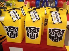 some yellow boxes with black and white decals on them