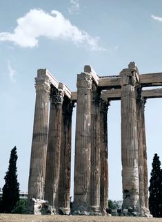 the ruins of an ancient city are shown against a blue sky