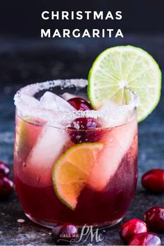 a christmas margarita with cranberries and lime