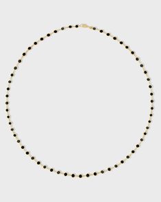 A stunning piece handcrafted with precision in New York City showcasing a series of perfectly round black onyx inlays, each encased in gleaming gold circles. The inlay technique is made in Italy and finished in New York City from our Marquet collection. Black Onyx 14 Karat Gold 15.5 to 17.5 inches Handmade in NYC Luxury Black Beads Jewelry For Formal Occasions, Luxury Formal Jewelry With Black Beads, Fine Jewelry Black Necklace With Black Enamel, Gold Round Necklace With Black Enamel, Luxury Black Diamond Round Jewelry, Formal Round Black Enamel Necklaces, Luxury Gold Jewelry With Black Beads, Elegant Black Necklace With Stones, Formal Black Enamel Round Necklaces