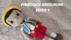 a crocheted stuffed animal is laying on a bed with the caption pinocchio amigurmi video 1