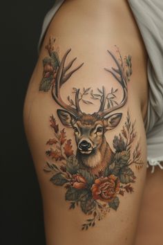 a deer with antlers and flowers on the thigh