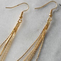 With these slim snake chain earrings, a little shimmer of gold will peek out from your hair offering a retro disco vibe that's also simply modern. gold-plated chain tassel gold-plated stainless steel ear wire hooks lead-free and nickel-free 3.25 inches long packaged on a hand-stamped kraft earring card in a clear resealing bag Minimalist Chain, Gold Tassel Earrings, Retro Disco, Minimalist Earrings Gold, Earring Card, Long Tassel Earrings, Earring Cards, Earrings Minimalist, Delicate Earrings