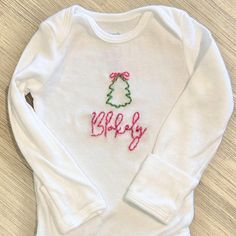 Unisex Short or Long Sleeve Christmas T-Shirt for Toddler or Onesie for Baby with your choice of name, thread color, placement and icon. Baby Christmas Shirt, Embroidered Onesie, Toddler Top, Christmas Onesie, Baby Girl Toddler, Embroidered Christmas, Christmas Custom, Hand Stitch, Girl Christmas